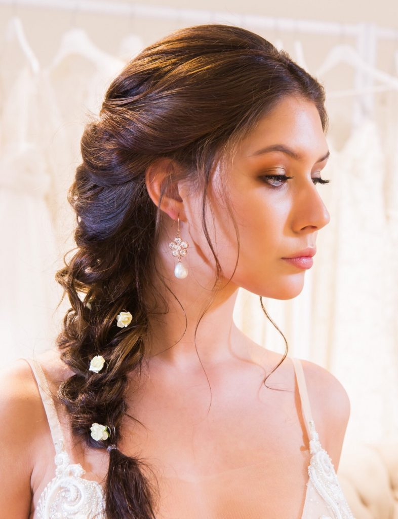 Plaited bridal hair with flowers - Makeup by Gurdeep Juttla - Hair by Mae Hair Speciaist - Photography by Ishootpeoplewedding #plait #braid #bridalhair #rusticbride #summerwedding