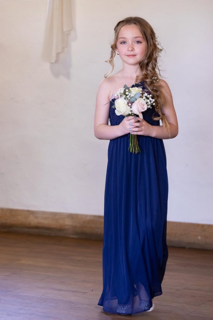 Flower girl holding flowers