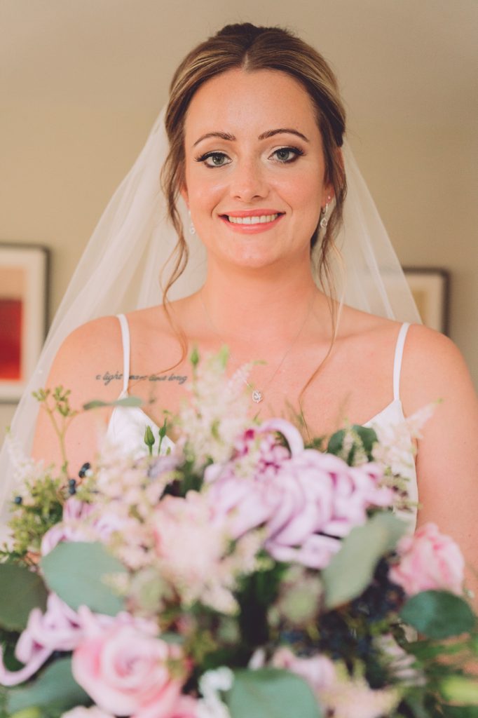 bride-with-pink-purple-bouquet