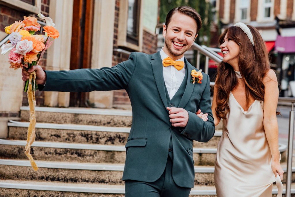 belle and bunty wedding dress with 1970s curls and pearl headband