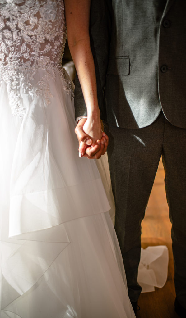 Bride and Groom Holding Hands