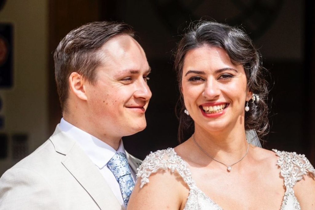 A heartwarming close-up of the beaming bride and groom.